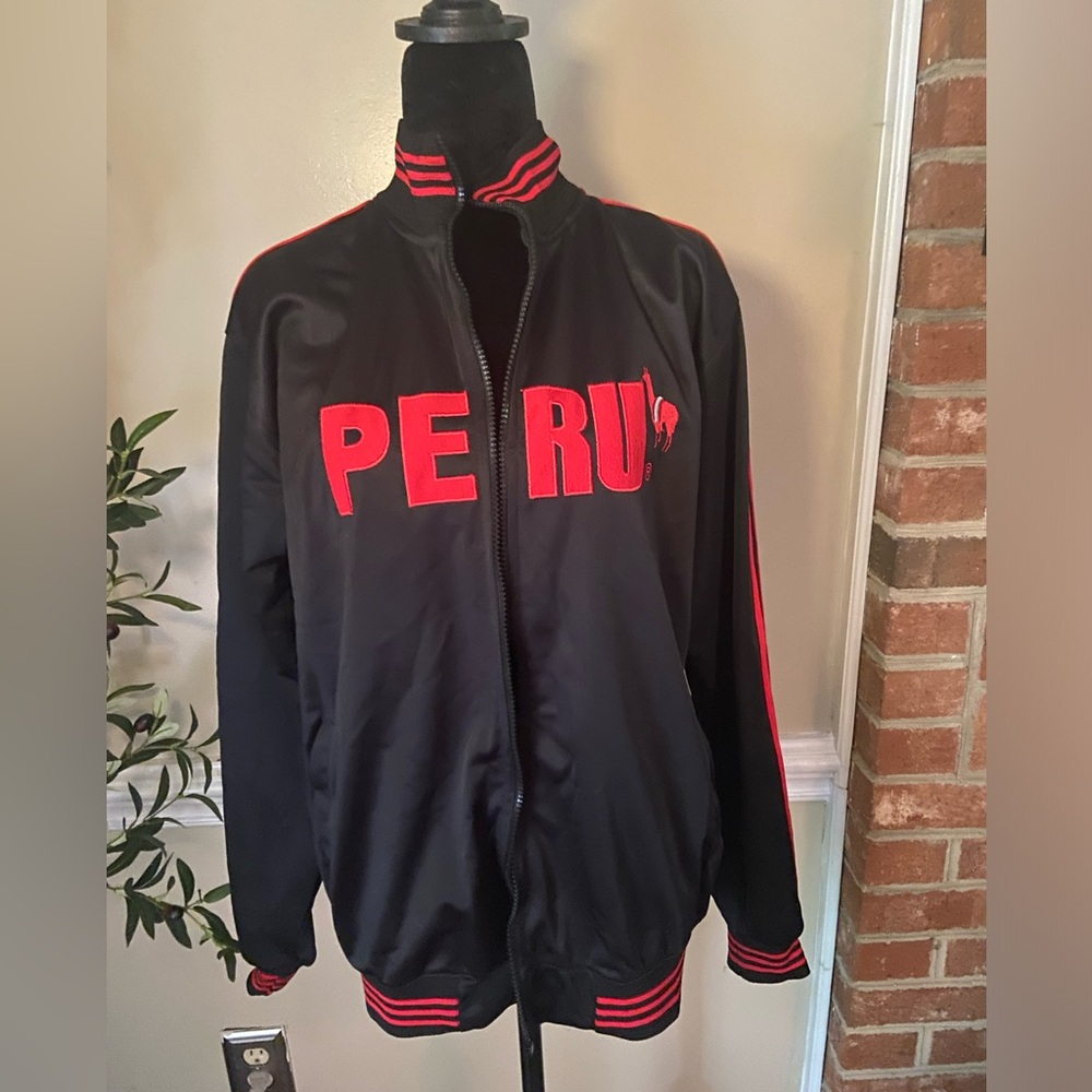 Jacket: Cuy-arts inka Peru soccer black Large.